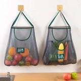 two mesh bags hanging on a wall