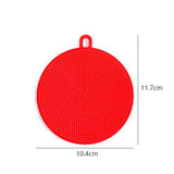 red round plastic cutting board with holes