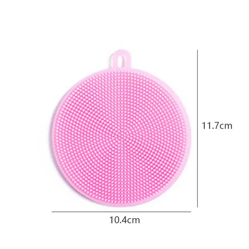 a pink plastic brush with a white dot pattern