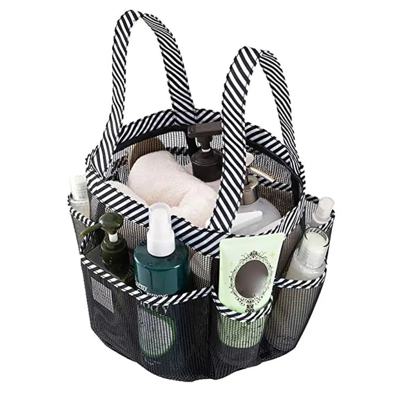 a black and white striped bag with a lot of beauty products inside