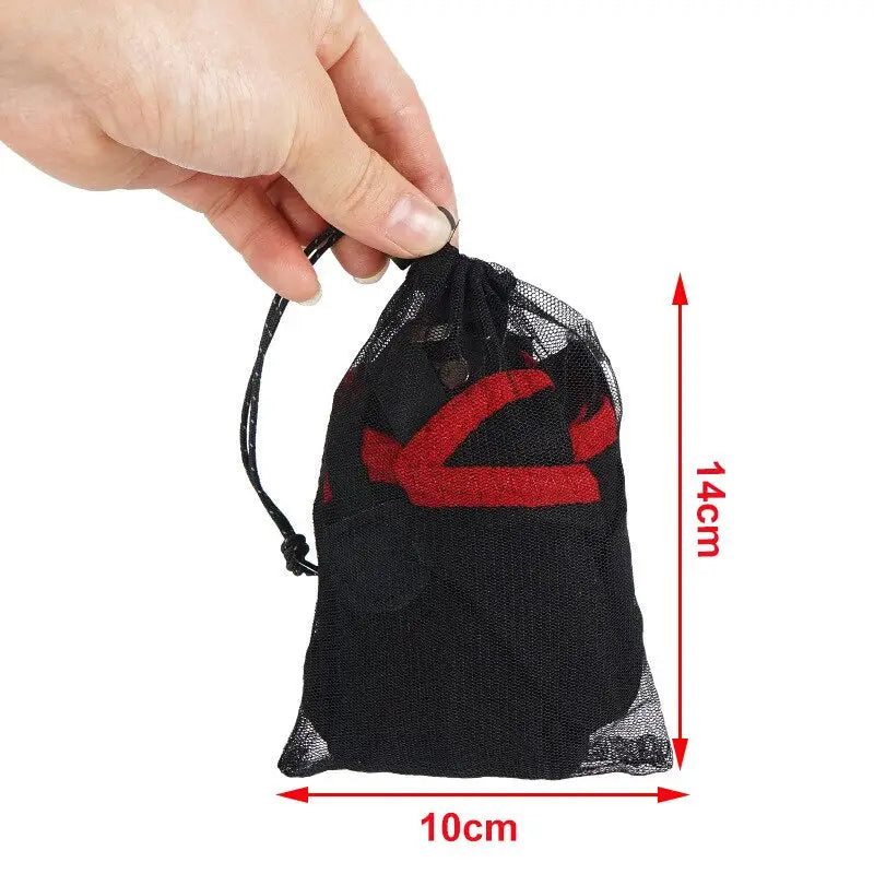 a hand holding a mesh bag with a red heart on it
