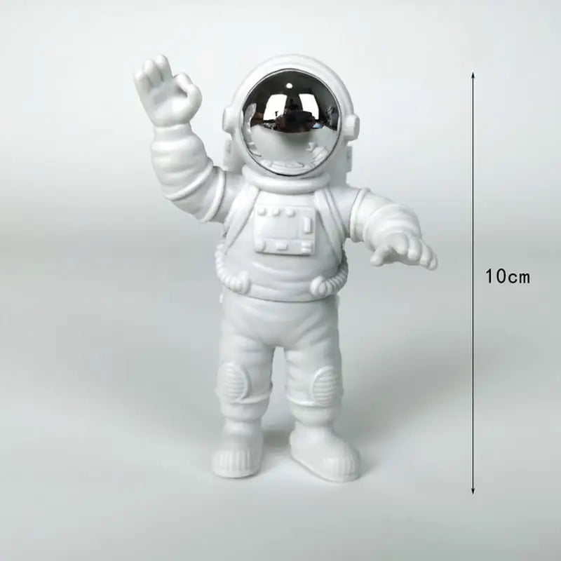 a white astronaut fig with a black helmet and white suit