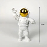 a white astronaut fig with a gold helmet