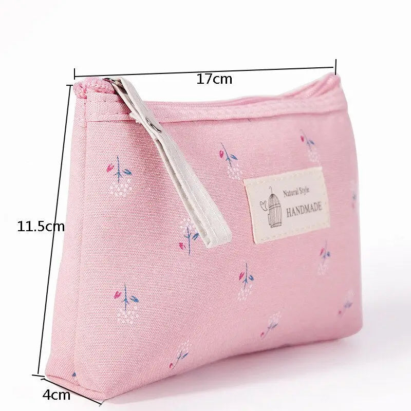 a pink cosmetic bag with a small zipper