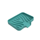 a green plastic tray with zebra print