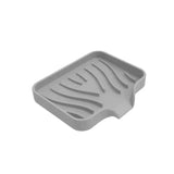 a grey plastic tray with zebra print