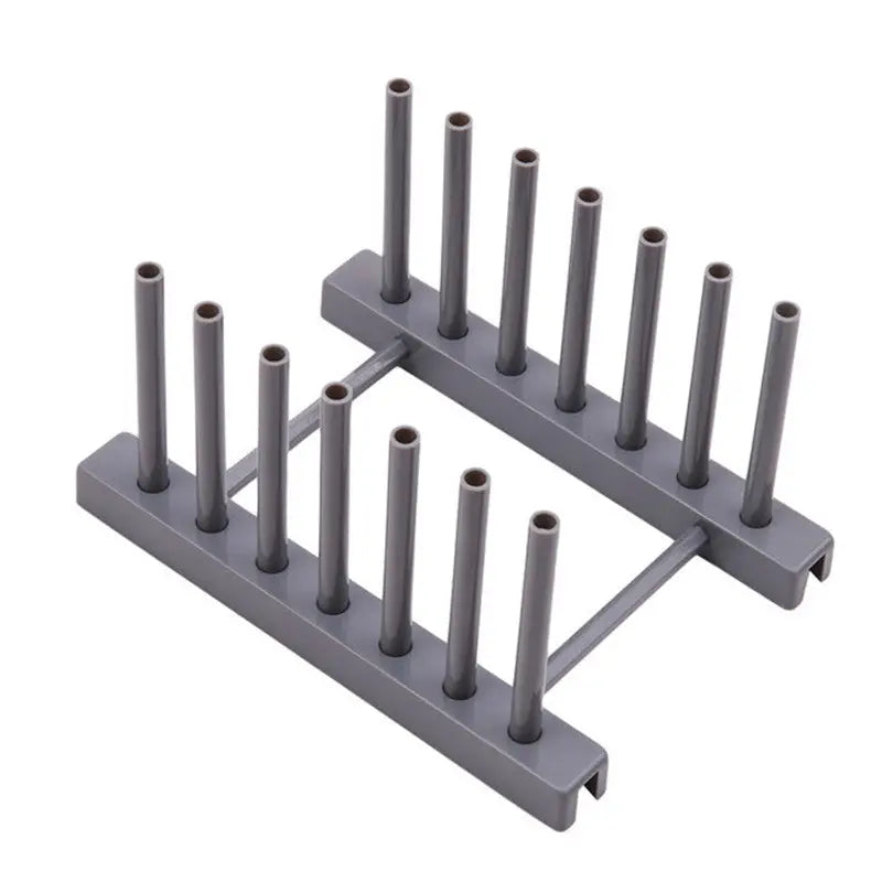 a set of four grey plastic pegs