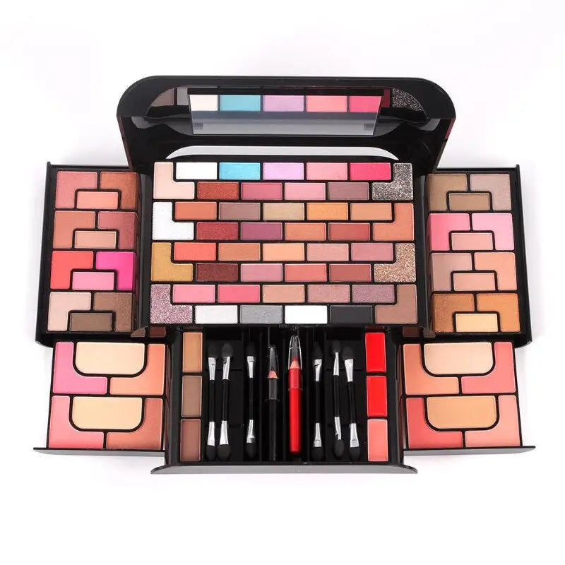 a makeup set with a mirror and brush