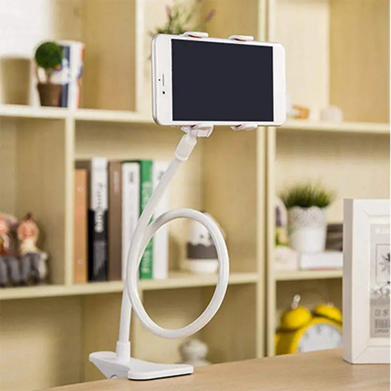 a white phone holder on a desk