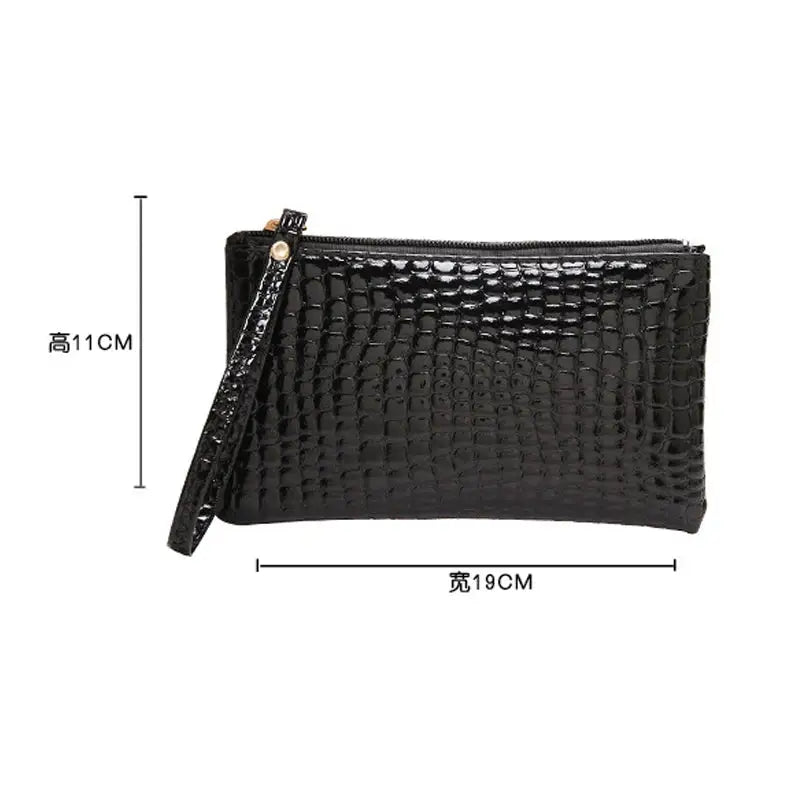 the black crocodile clutch bag