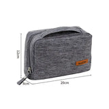 the grey travel toilet bag with a zipper closure