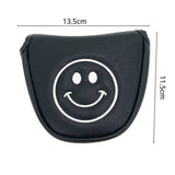 a black leather car key case with a smiley face