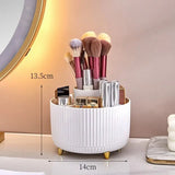 a white makeup brush holder with a mirror in the background