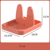a pink plastic box with a hole for a small hole