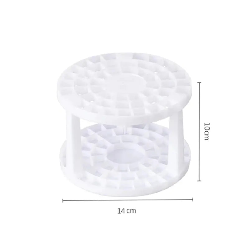 a white plastic cake stand with a white base