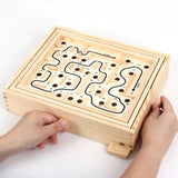 a person is playing a game with a wooden box