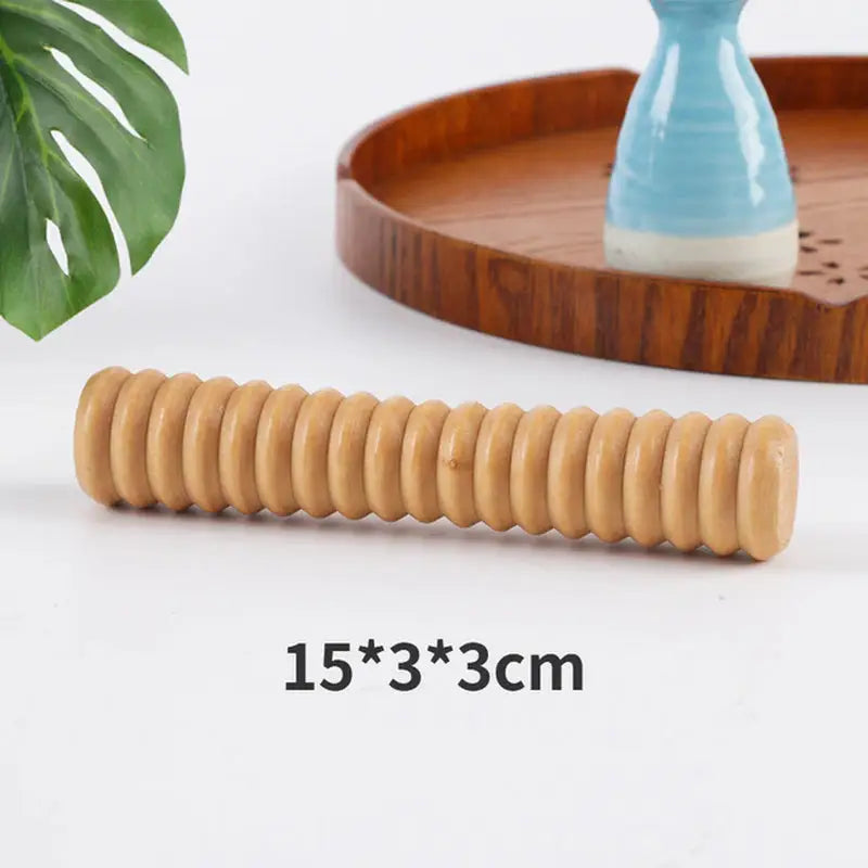 a wooden rolling board with a wooden roller on it