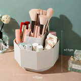 a white container with makeup brushes and makeup brushes