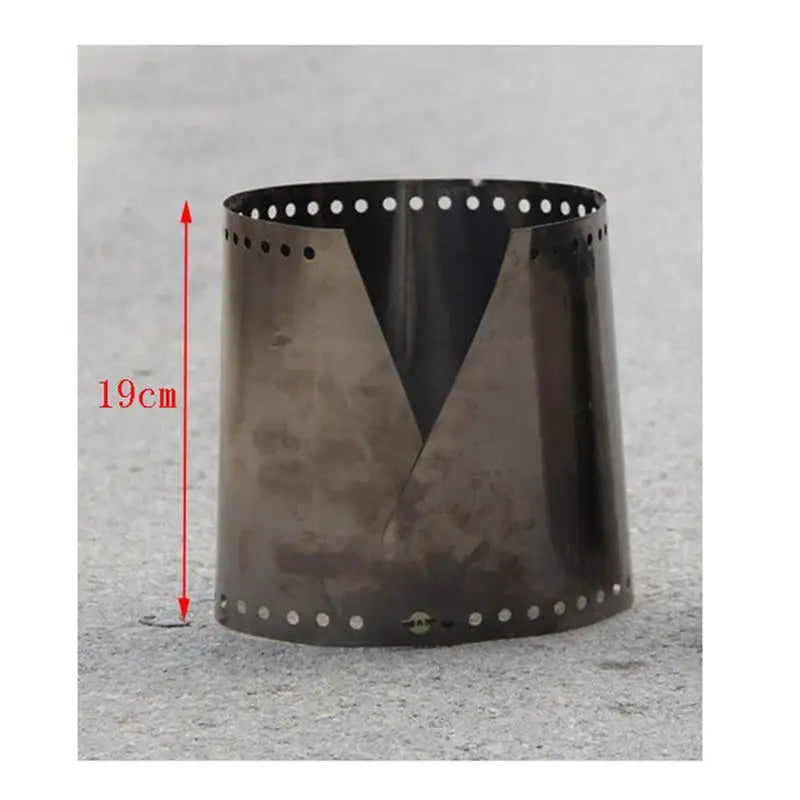 a black metal cup with holes and holes