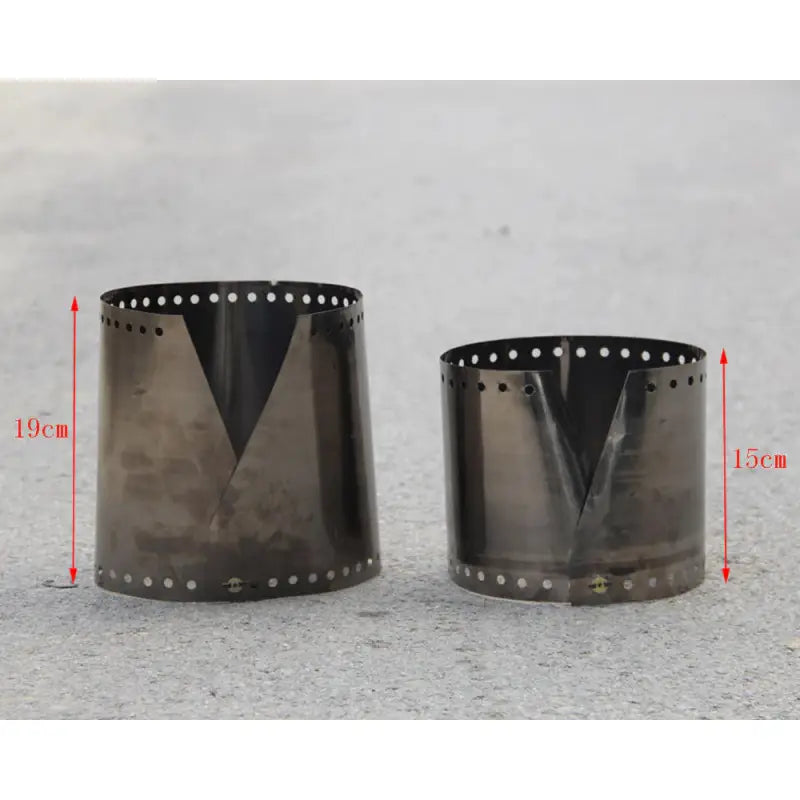 two metal cups with holes and holes on them are shown