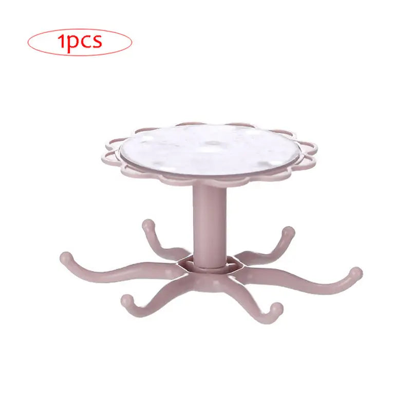 a pink plastic table with a white base