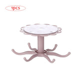 a pink plastic table with a white base