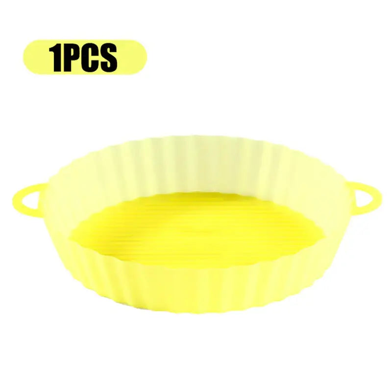 a yellow plastic cake pan with a white background