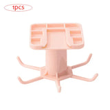 a pink plastic table with a white base