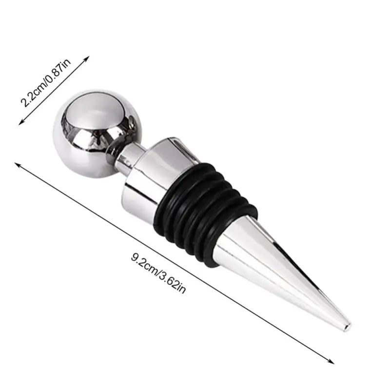 a silver and black wine bottle stopper with a metal tip