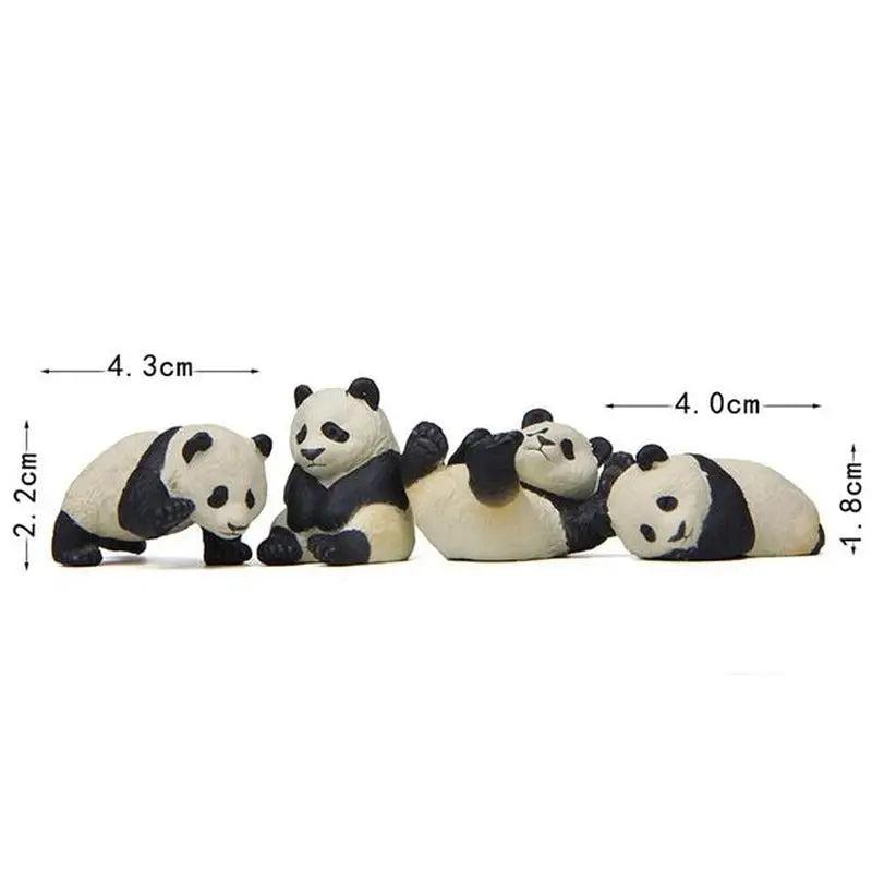 three panda bears laying down on the ground