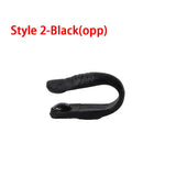 a black plastic hook with a white background