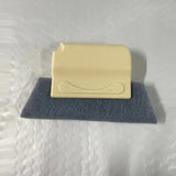 a yellow soap bar on a blue towel