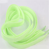 a close up of a pair of neon green shoe laces