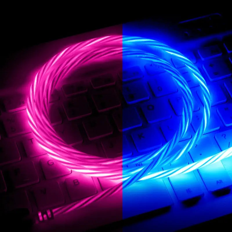 a computer keyboard with a neon blue and pink light