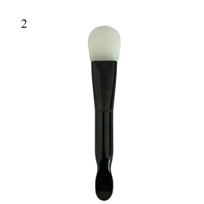 the face brush with a black handle
