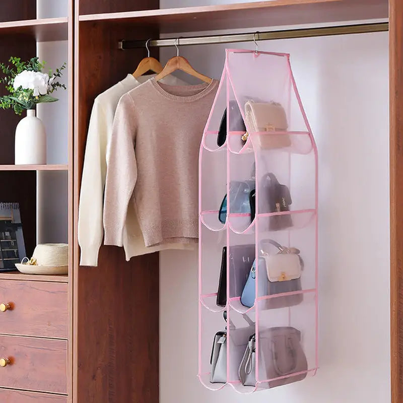 a pink hanging organizer with a pair of shoes