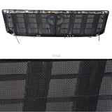 a close up of a grille with a black mesh covering