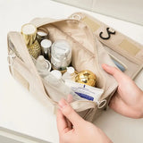 a person holding a bag filled with items