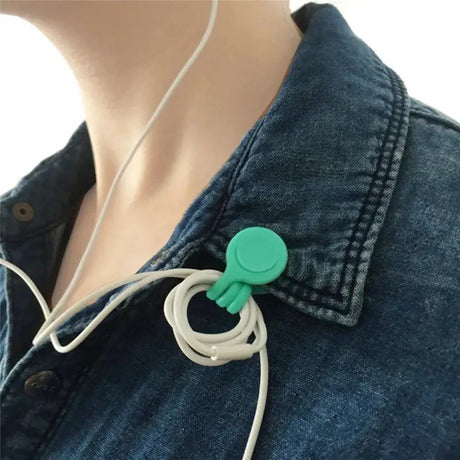 a woman wearing a blue denim jacket and earphones