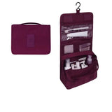 the travel toilet bag in burgundy