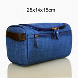 a blue toilet bag with a brown handle