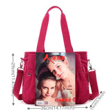 a red bag with a picture of a woman and a magazine