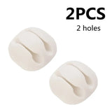 two white plastic knob covers for a pair of two holes