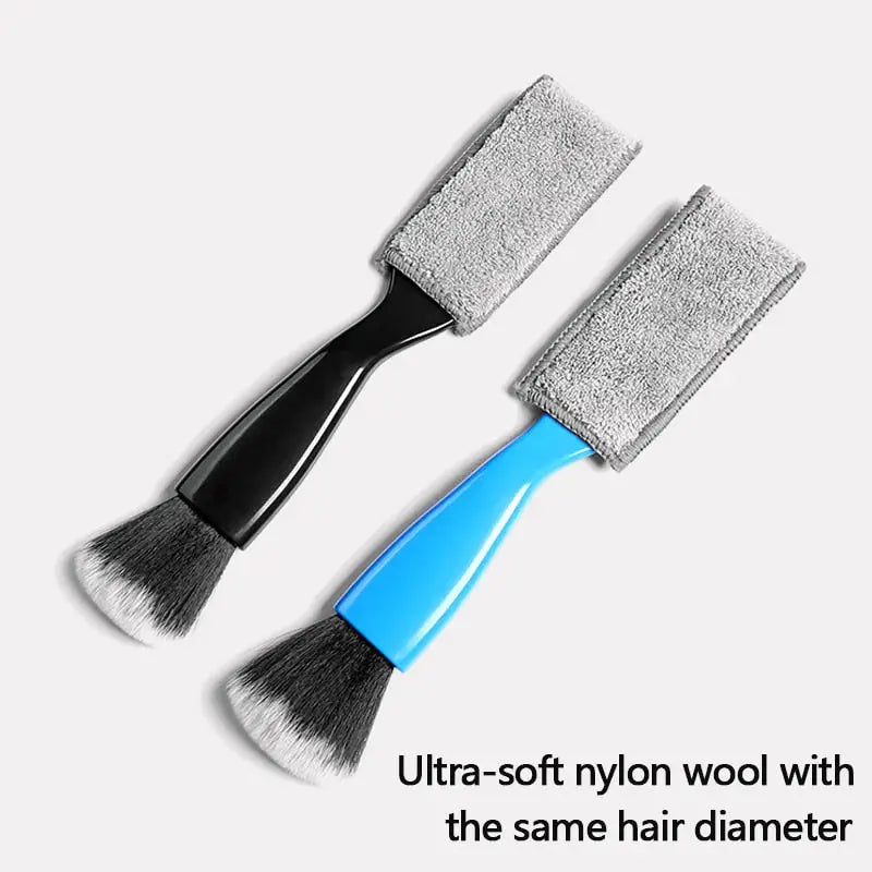 two brushes with a blue handle and a black handle