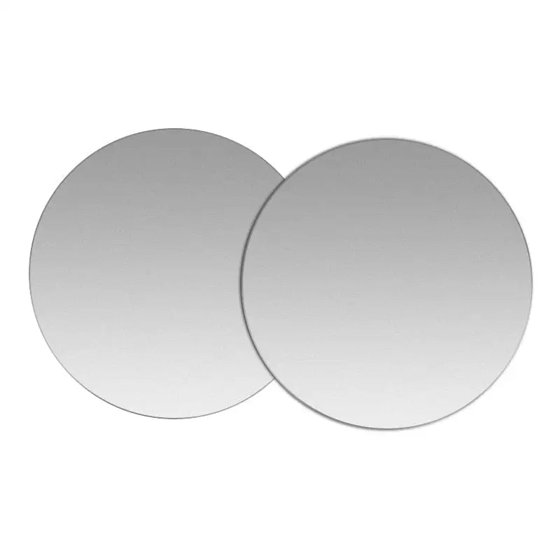 two round mirrors with a white background