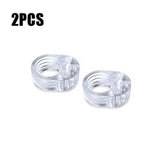 two clear plastic rings with a white background