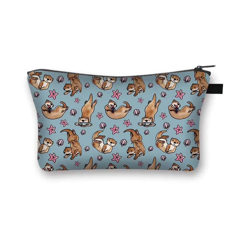 a blue cosmetic bag with a pattern of dogs and stars