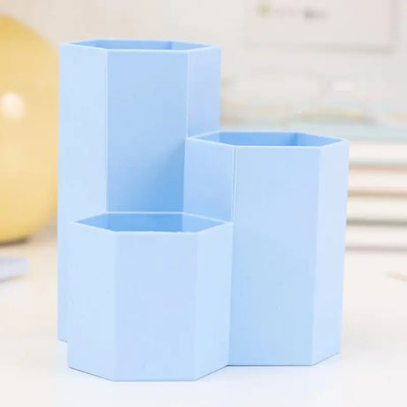 three blue vases on a table