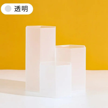 a white vase sitting on top of a table