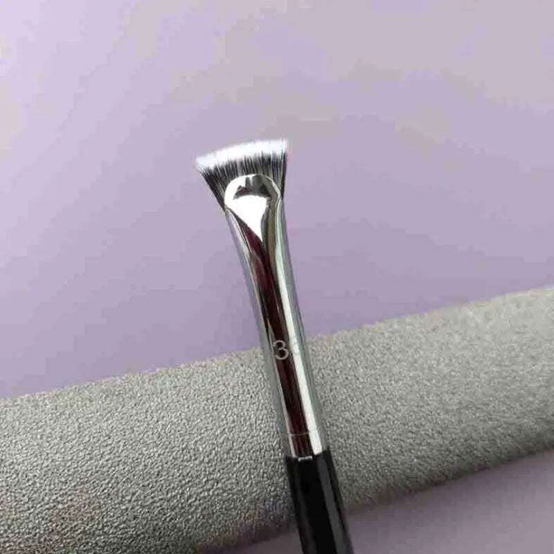 a brush with a white handle on a purple background